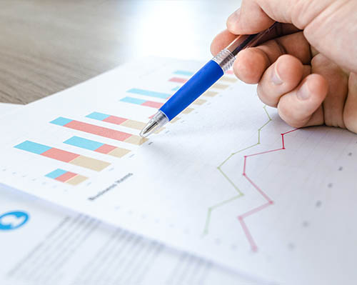sales forecasting - Person reviewing his sales forecast