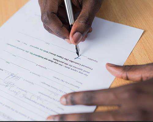 Buyer Process - Buyer signing a purchase agreement